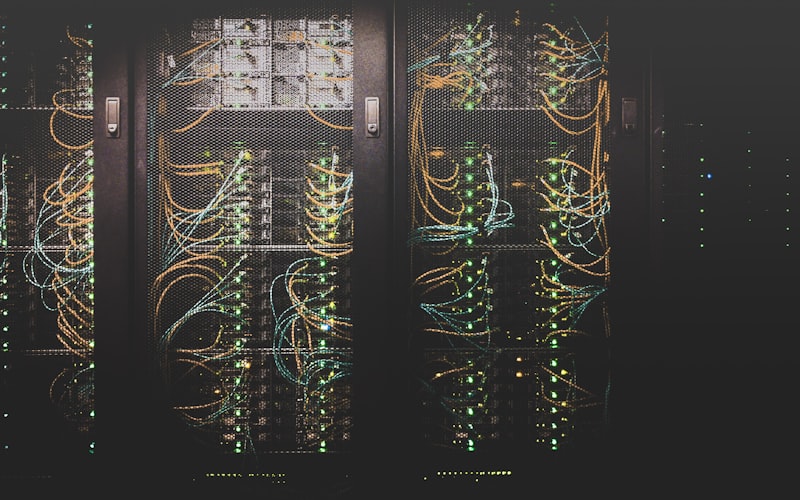 Technician managing and backing up server racks in a modern green data center